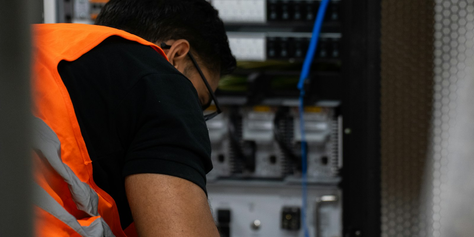 Technician servicing equipment for a managed IT services client